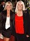 Wendy Richard, dressed elegantly in red and black, with colleague Letitia Dean