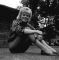 Wendy Richard sitting on the grass in Argyll Square.  July 1962 publicity photo.