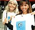 Wendy Richard and Maria Whittaker model a "Dolphin Friends" shirt, 1990.