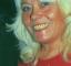 Wendy Richard, smiling and wearing a red evening dress, at the Water Rats 
				  charitable ball, November, 1998.