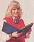 Wendy Richard as Pauline holding a photo album