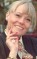 Wendy Richard in a suit and tie, smiling for the camera, circa 1996