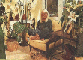Wendy Richard sitting in her living room