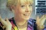 Wendy Richard shows off in jewelry and an evening dress, early 1991.