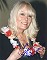 Smiling Wendy Richard, wearing a flower lei, circa mid-1998