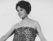 Wendy Richard modeling a leopard-spot wrap-around.