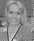 Wendy Richard, with polka dot dress and wind-blown hair