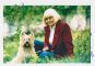 Wendy Richard and her dog pose in a pastoral setting in Regents Park.