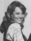 A black and white photo of a happy Wendy Richard, about 1981.