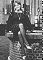 Wendy Richard, sitting on a well, Holland, 1977
