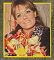 Close-up of Wendy Richard, smiling with flower bouquet, Holland, 1977